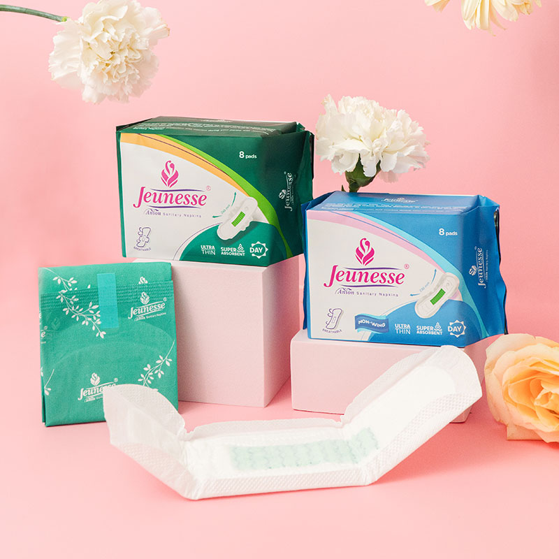 Jeunesse Ultra Absorbent Day Pad with other Jeunesse packs and fresh flowers